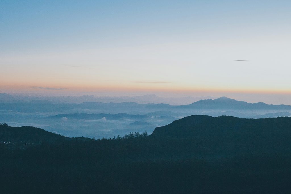 Catch Up and Clean Up bookkeeping services illustrated by a clear mountain landscape representing restored order and clarity.